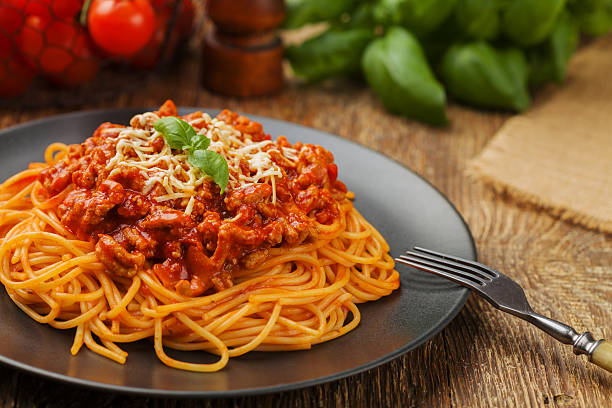 istock Delicious spaghetti served on a black plate 585629806