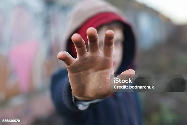 Dramatic Portrait Of A Little Homeless Boy Dirty Hand Stock Photo - Download Image Now