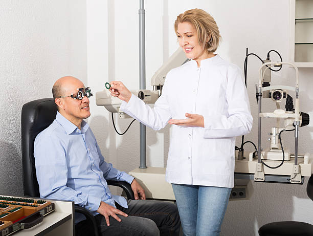 istock Adult optician examinating eyesight 585763320