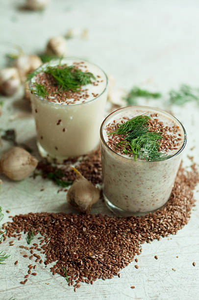 istock Glass of yogurt with crushed flax seeds 585763356