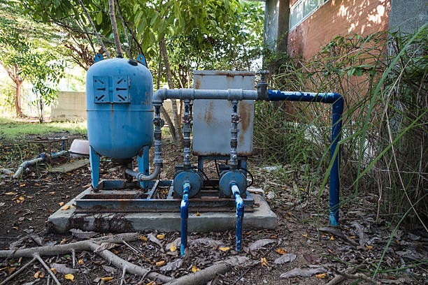 Old rusty electronic water pump in the forest