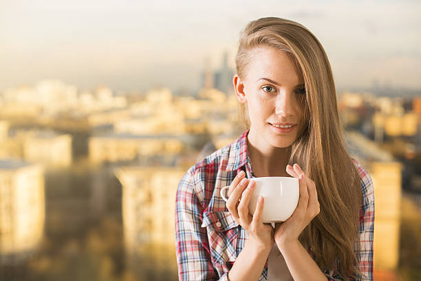 istock Young woman drinking coffee 585763920