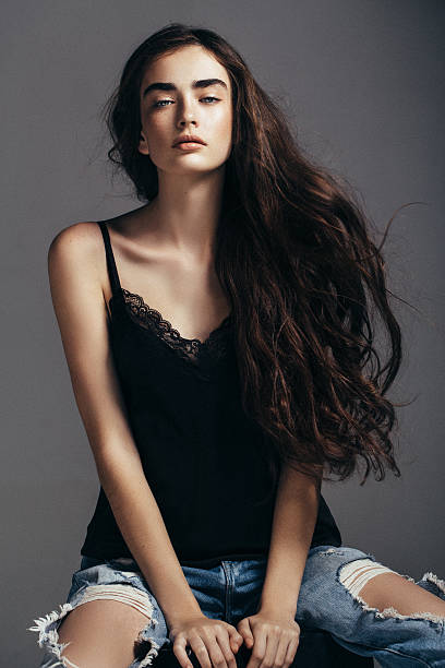 istock Beautiful girl sitting at the studio 585765112
