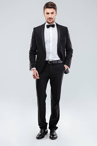 istock Confident attractive young man in tuxedo 585768258