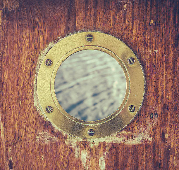 istock Vintage Brass Porthole With Ocean Water 585769644