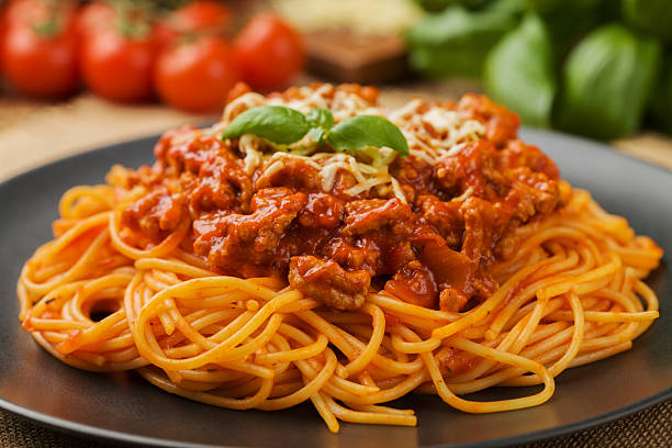 istock Delicious spaghetti served on a black plate 585769848