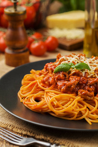 istock Delicious spaghetti served on a black plate 585769964