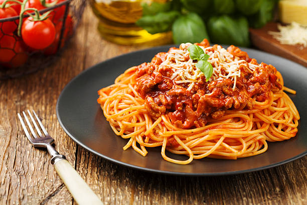 istock Delicious spaghetti served on a black plate 585770092