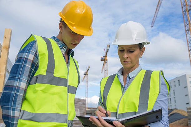 istock Portrait of builder works at construction site 585770814