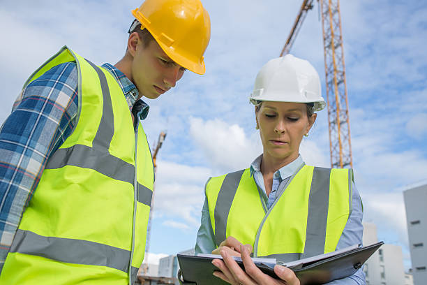 istock Portrait of builder works at construction site 585770900