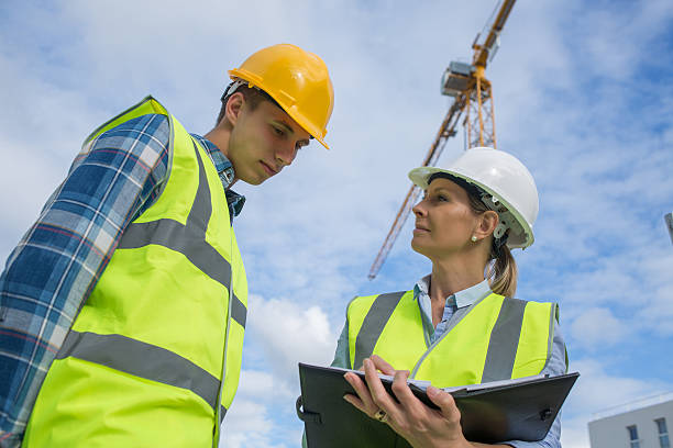 istock Portrait of builder works at construction site 585771034