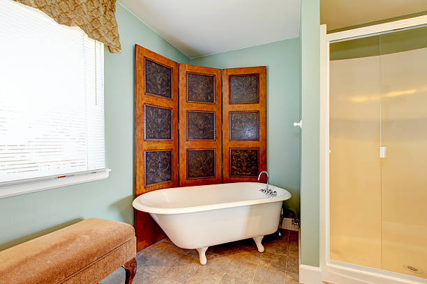 istock Antique bathroom interior with white bath tub 585771378
