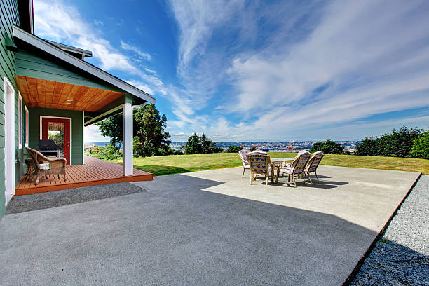 VIew of large concrete floor patio area at backyard stock photo
