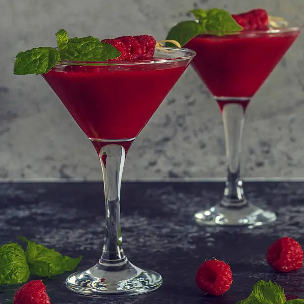 Red cocktail with raspberries, selective focus.