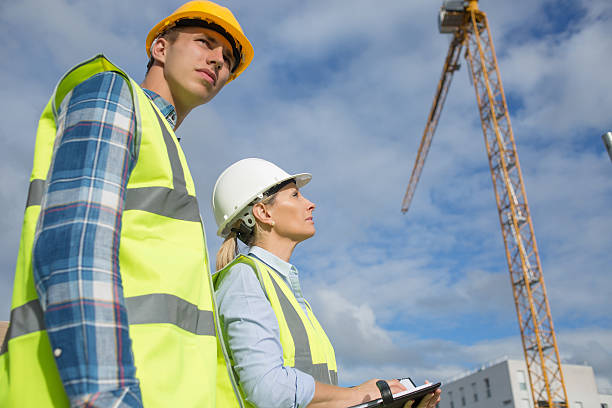 istock Portrait of builder works at construction site 585771958