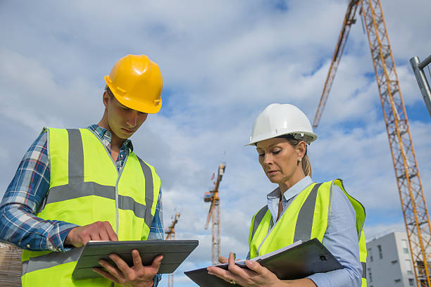 istock business, building, paperwork and people concept 585772280