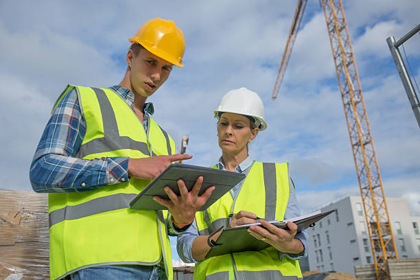 istock business, building, paperwork and people concept 585772620
