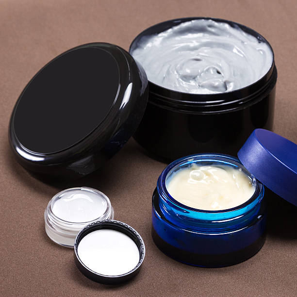 istock Several jars of different sizes filled with creams 585772742