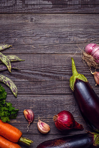 istock Fresh vegetables for cooking on dark wooden background. 585773072