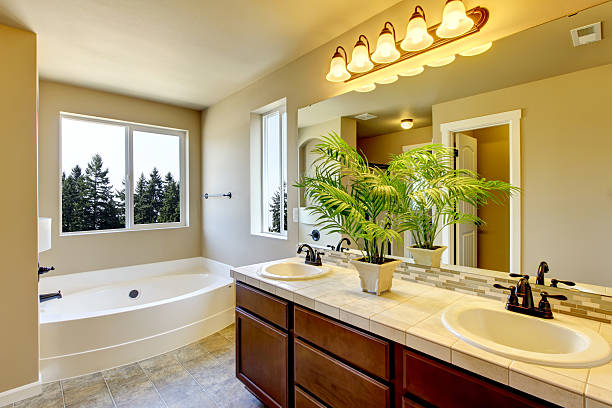 istock Bathroom interior with beige walls and tile flooring. 585773688