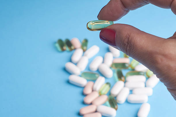 istock Medicine pills or capsules in hand 585773944