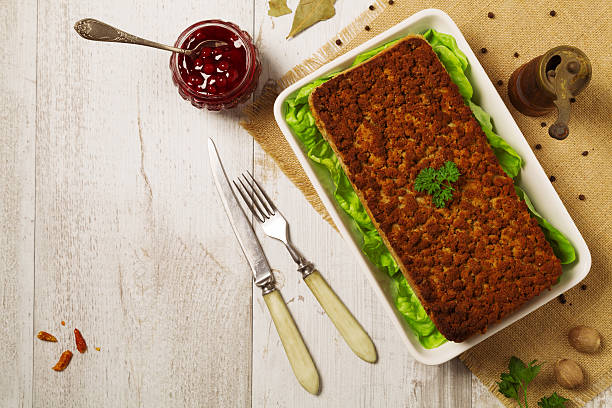 istock Homemade meat pie with vegetables, served with cranberry sauce 585775164