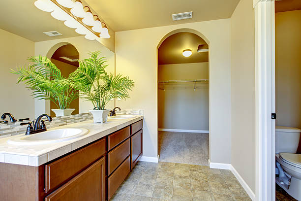 istock Bathroom interior with beige walls and tile flooring. 585775186