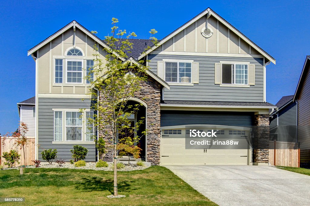 Luxurious modern house with entrance high ceiling porch. Luxurious modern house with entrance high ceiling porch and stone trim. Northwest, USA Stone House Stock Photo