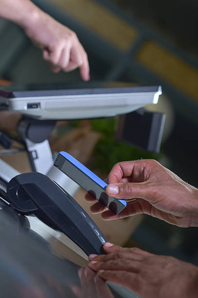 istock Payment in a trade with nfc system mobile phone. 585778734
