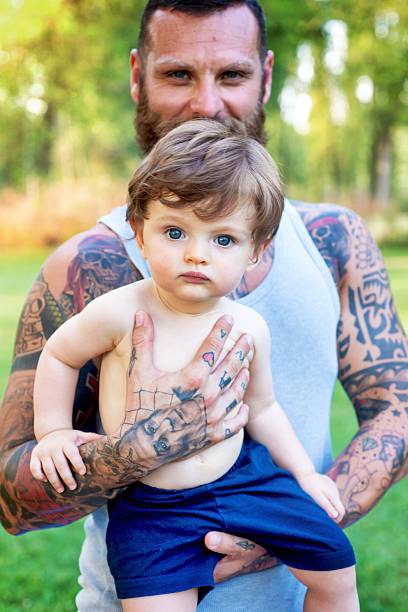 istock Tattooed Father and Son Portrait 585779566