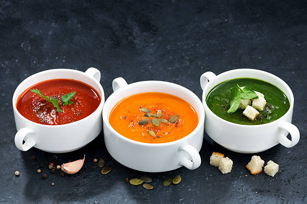 istock assortment of vegetable cream soup on a dark background 585779678