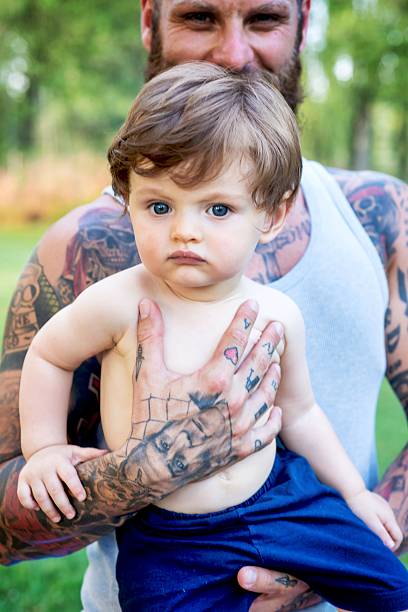 istock Tattooed Father and Son Portrait 585779884