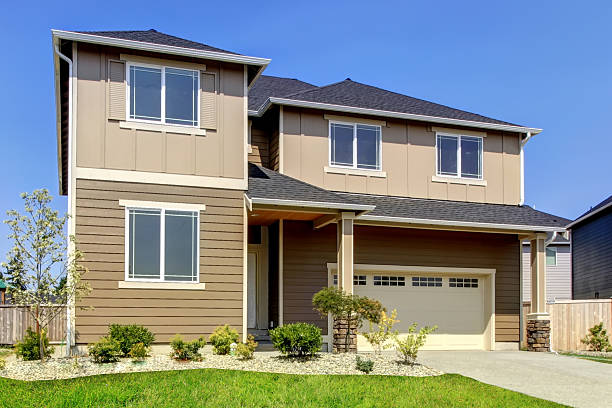 istock Beige and Brown siding house exterior. 585780354