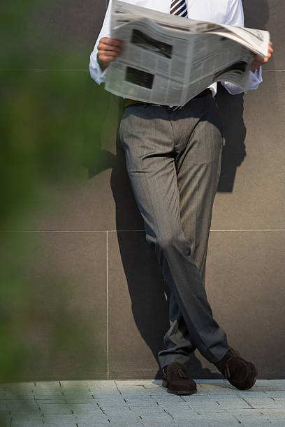 istock Business man reading a newspaper 585784202