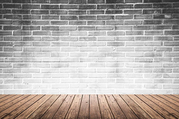 istock interior room with brick wall and wood floor 585784224