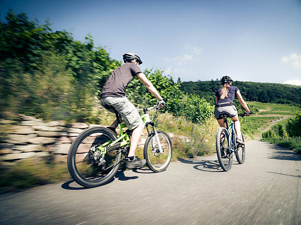 istock Young couple riding their mountain bikes 585785022