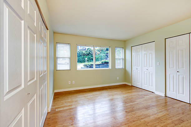 istock Empty room interior with hardwood floor and three closets. 585785678