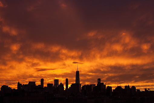 Image of Manhattan's sunset captured summer of 2015 featuring a centered lenticular cloud over the One World Trade Center.