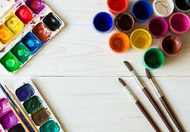 istock Painting set: brushes, paints, watercolor, acrylic paint on a wh 585787312