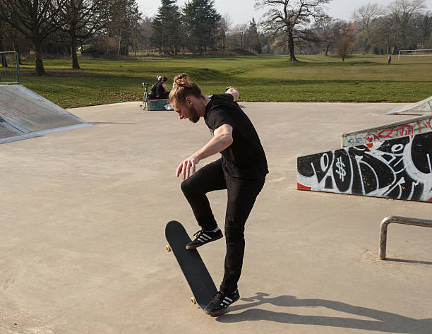 Skateboarder preparing to excecute a trick stock photo
