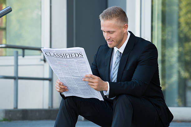 istock Businessman Reading Newspaper 585789776