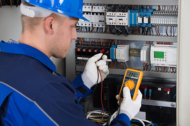 istock Male Technician Examining Fusebox 585790070