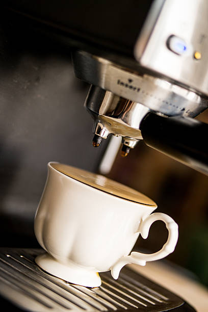 istock espresso machine making coffee and pouring in a white  cup 585791660