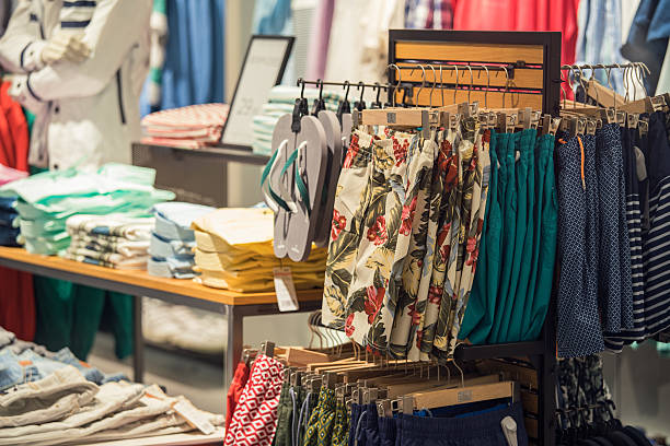 istock Clothing Store Interior With Summer Clothes On Foreground 585794940