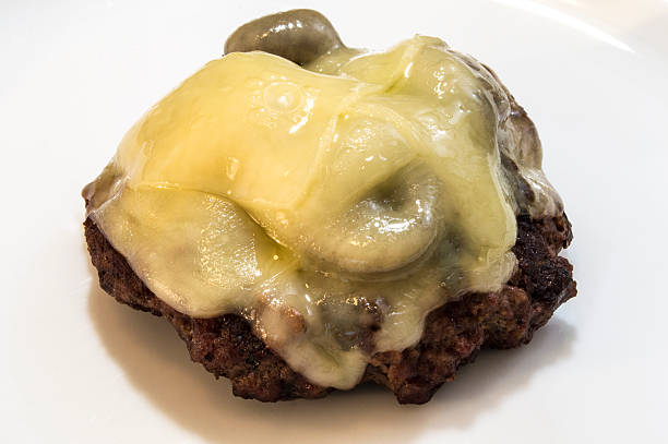 istock Close up mushroom swiss burger close up isolated without bun 585796230