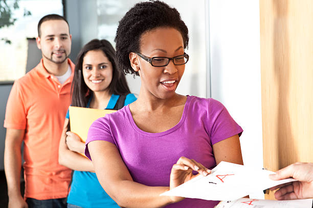 istock Education: Multi-ethnic group of college students in classroom. 585796574