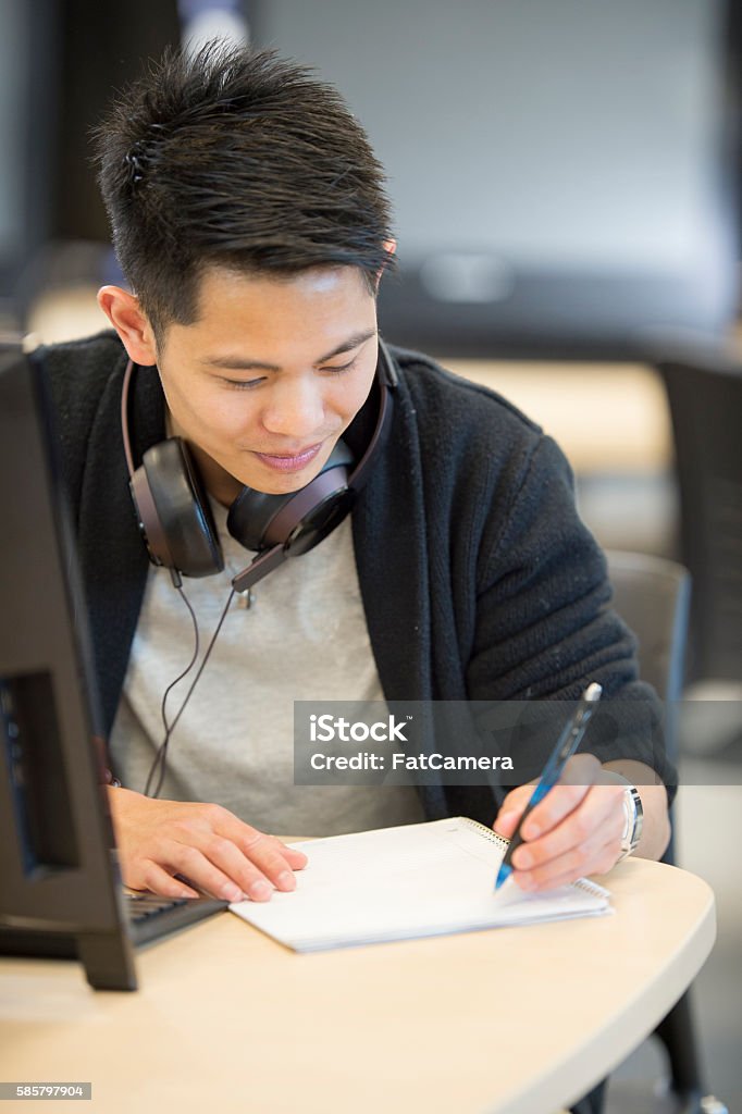 Asignment Pic College Student Writing An Assignment Stock Photo - Download Image Now ...