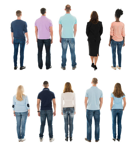 Rear View Of Creative People Standing In Row Rear View Of Creative People Standing In Row Against White Background behind stock pictures, royalty-free photos & images