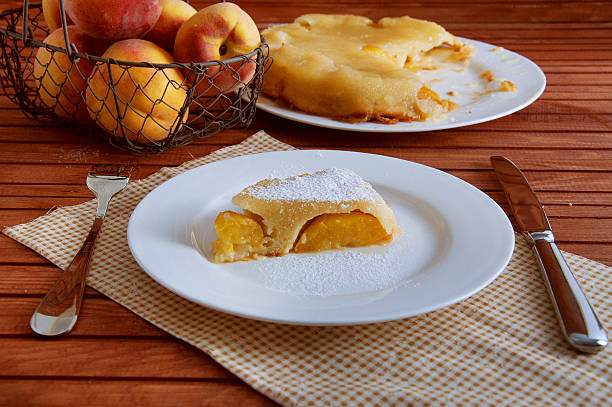 istock Peach caramel turnover pie sprinkled with sugar powder 585798862