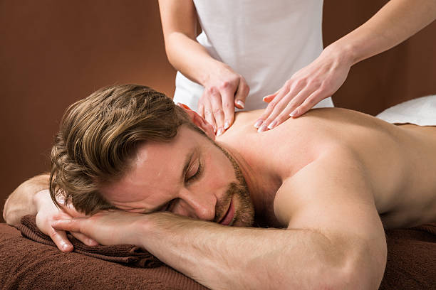 istock Young Man Receiving Back Massage At Spa 585799786